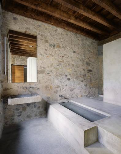 The clean-lined concrete bathroom