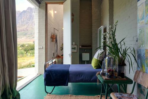 One of the bedrooms with views out over the surrounding mountain range