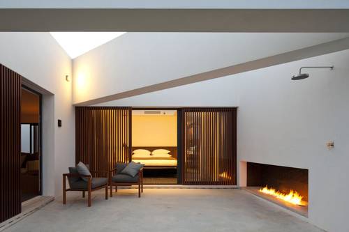 One of the rooms with private fireplace and verandah